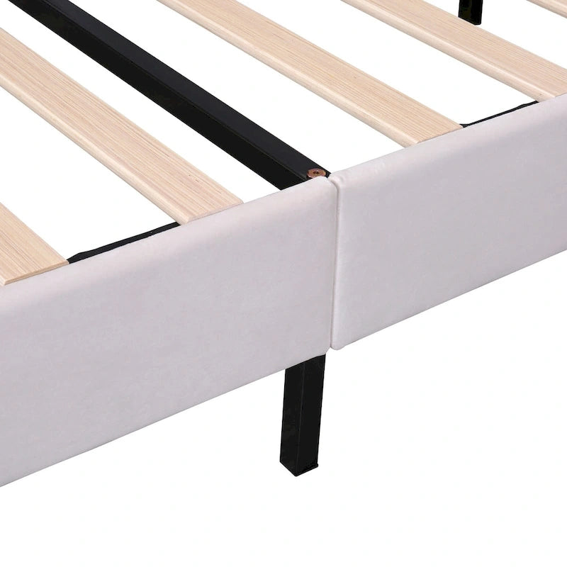 Cama con plataforma tapizada y cabecero con estampado floral