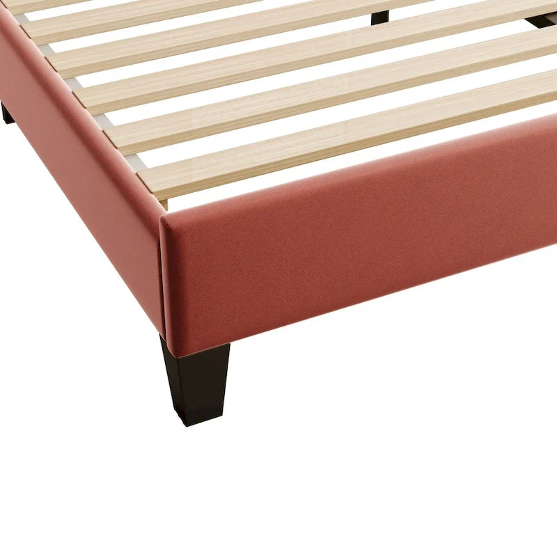 Cama con plataforma tapizada y cabecero con estampado floral