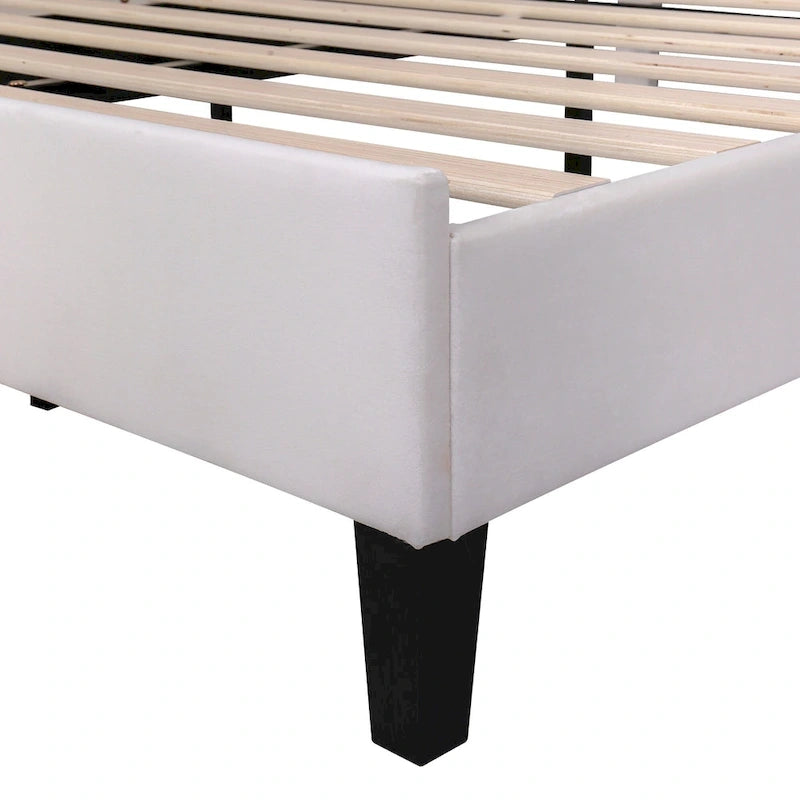 Cama con plataforma tapizada y cabecero con estampado floral